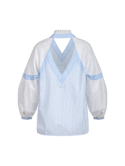 Gerade geschnittene Bluse mit nachhaltigem Design. Hergestellt aus Baumwollstoffen mit verschiedenen Streifen.