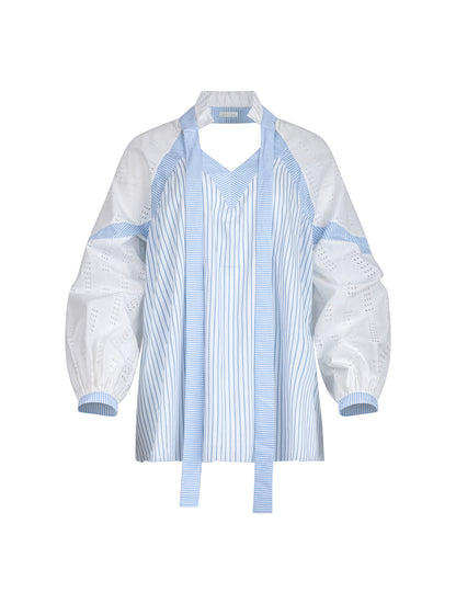 Gerade geschnittene Bluse mit nachhaltigem Design. Hergestellt aus Baumwollstoffen mit verschiedenen Streifen.