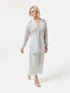Gestreifte Oversized-Bluse mit hohen Seitenschlitzen, breiten Manschetten und geschwungener Rückenpasse.